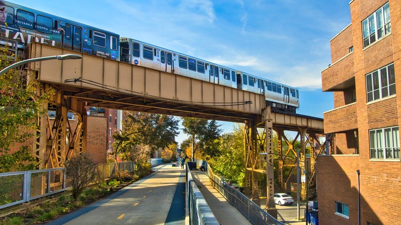 A train rumbles along its track above The 606