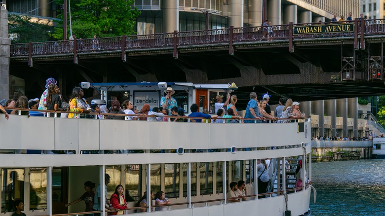 Passengers look out at the Chicago River from a Wendella cruise boat