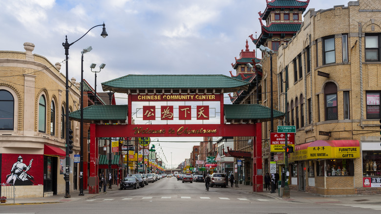 An image of Chinatown Gate, which is red and teal with the text "Welcome to Chinatown" in gold