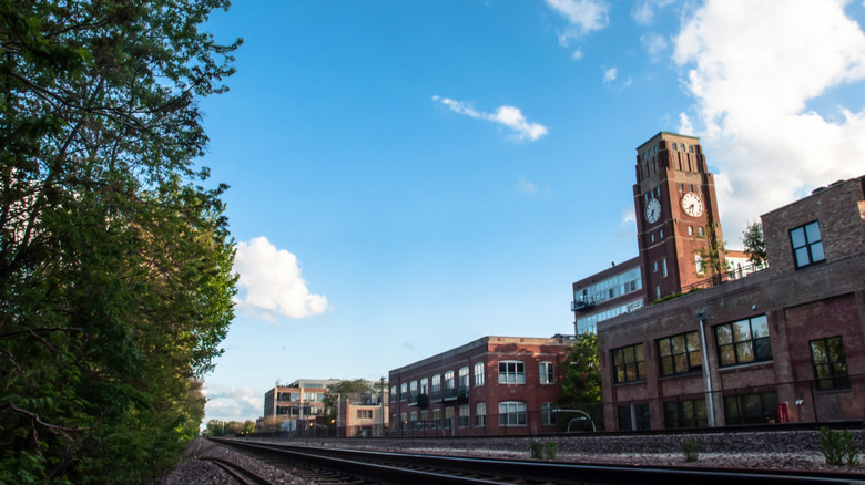 Industrial buildings tower above the railroad tracks in Ravenswood