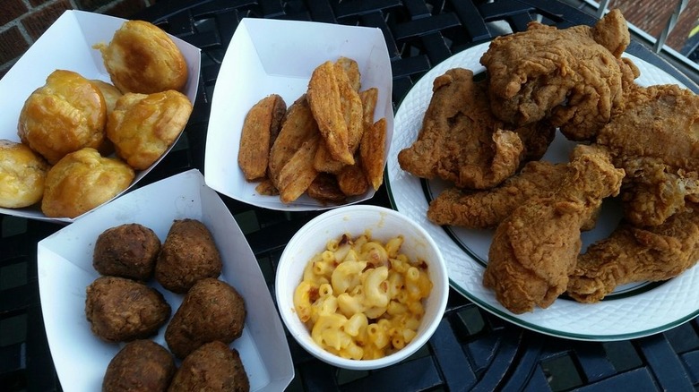 Fried chicken, mac n cheese, boudin balls, fries, and honey biscuits