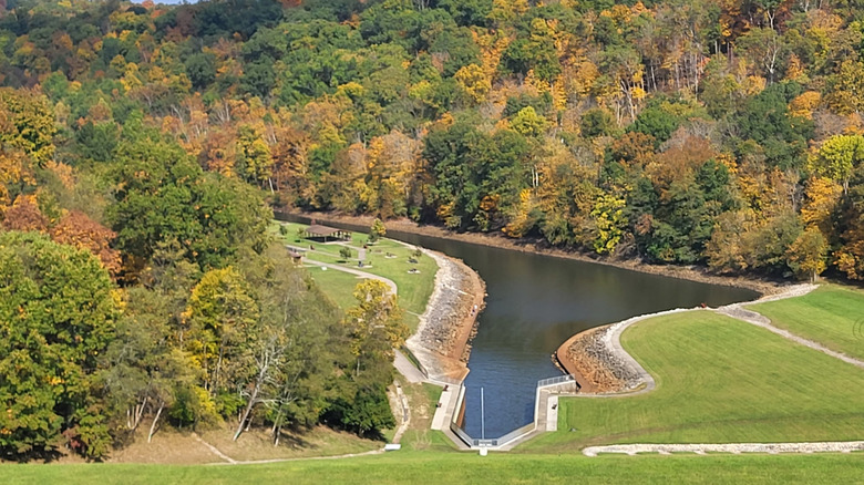 an aerial view of the William H. Harsha Lake surrounded by stunning fall foliage