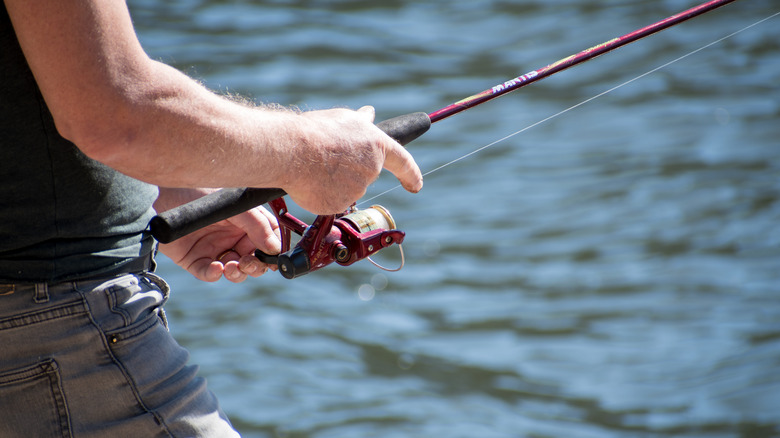 A man fishes in a lake