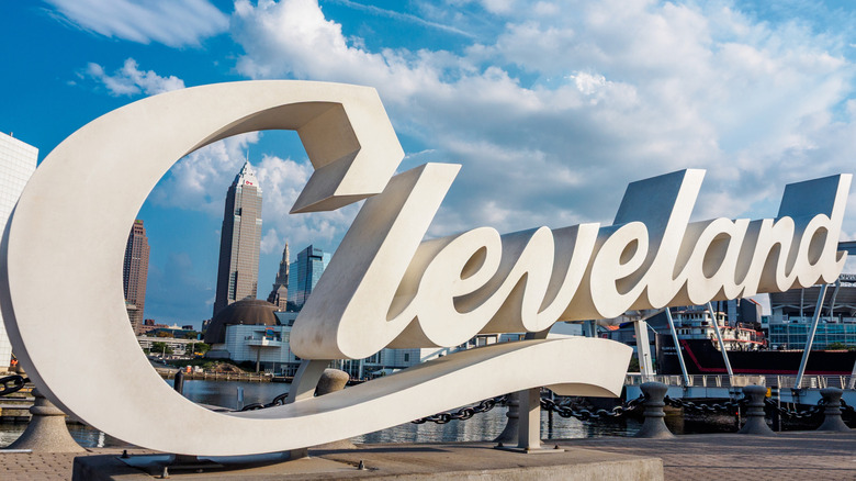 Cleveland script sign with downtown in the background