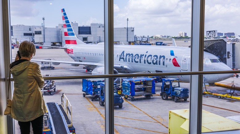 woman waiting for american airlines plane