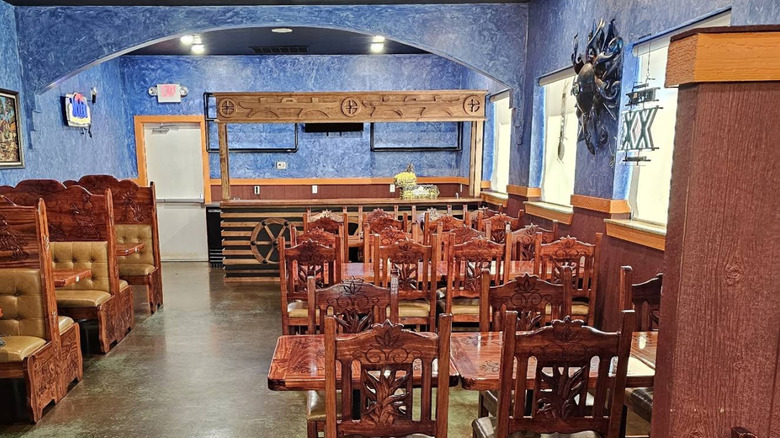 Seating and blue walls inside a restaurant