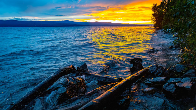 A scenic, colorful view of Flathead Lake captured at sunset