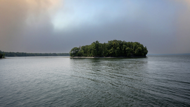 Wooded island on the eve of a storm Champlain Lake