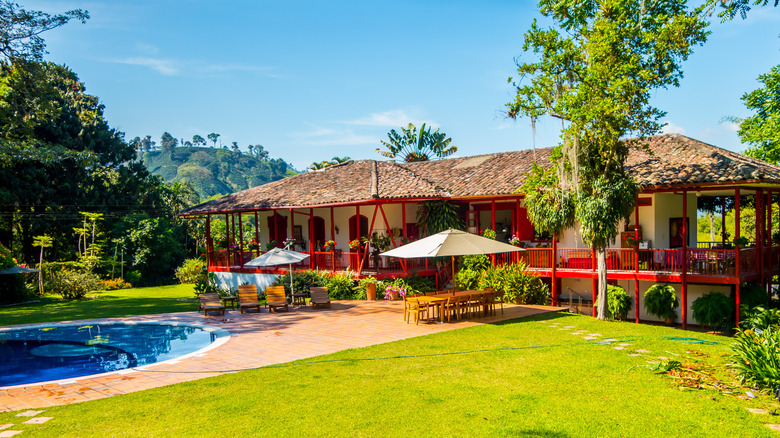 View of Hacienda Venecia Hotel with a pool
