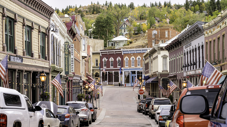 Looking down the main street of downtown Central City, Colorado, with historic brick buildings