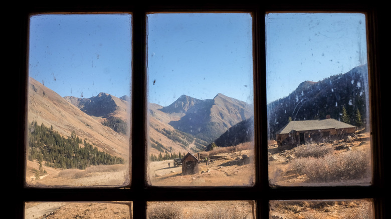 View of the mountains from a ghost town building in Animas Forks, Colorado