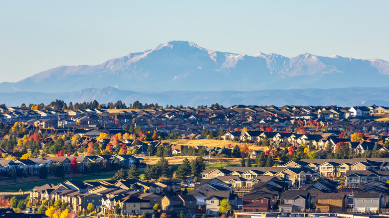 A view of Denver, Colorado with mountains in the distance