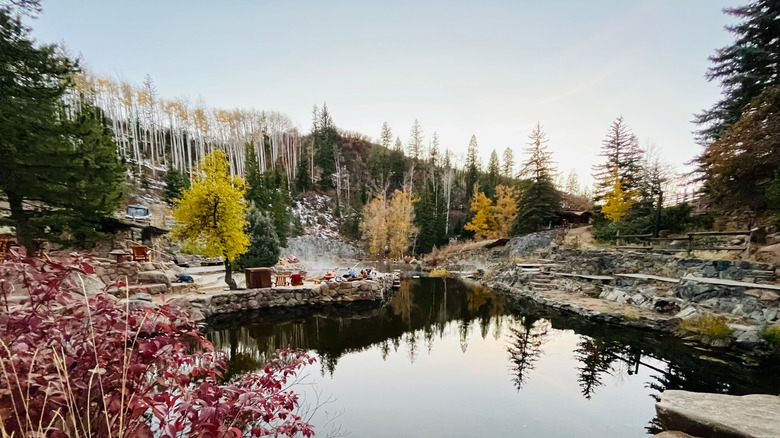 The hot springs and surrounding landscape of Strawberry Park Natural Hot Springs in Steamboat Springs, Colorado