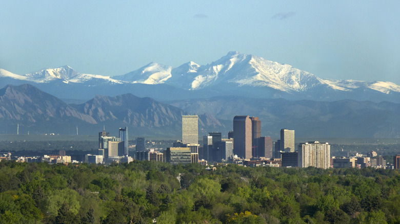 View of Denver's skyline with Rocky Mountain snowy peaks in background