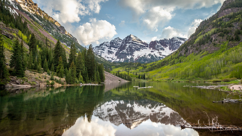 mountains and trees reflected in Maroon Bells Lake, in the Maroon Bells-Snowmass Wilderness area