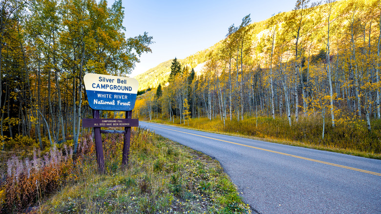 Maroon Bells sign for Silver Bell Campground and white river national forest in Aspen, Colorado rocky mountain in autumn fall colorful season