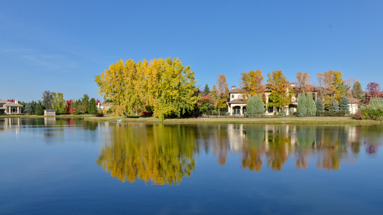 Homes backing onto a lake in Cherry Hills Village on a sunny day