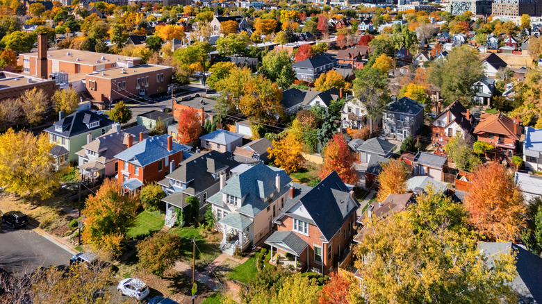 Aerial view of residential houses in Denver during fall when the leaves change colors