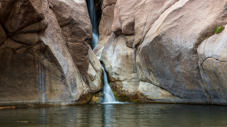 Paradise Cove swimming hole waterfall through enormous boulders