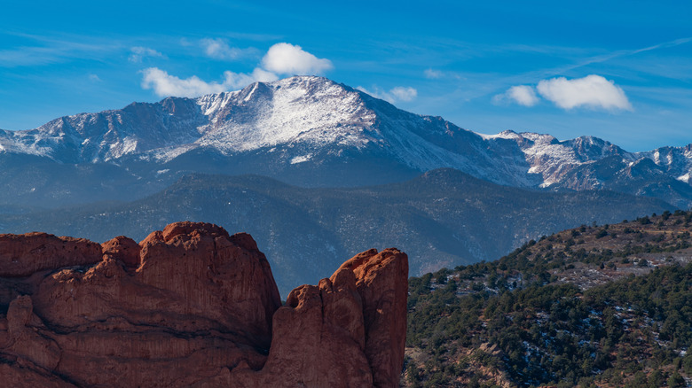 Snow capped Pikes Peak near Colorado Springs, Colorado, in winter with Garden of the Gods in foreground close up