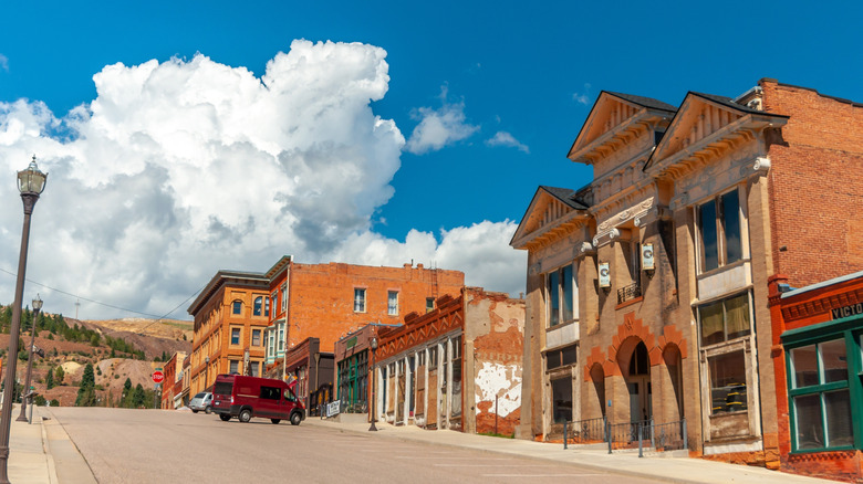 Downtown Victor, Colorado, with puffy clouds in the blue sky