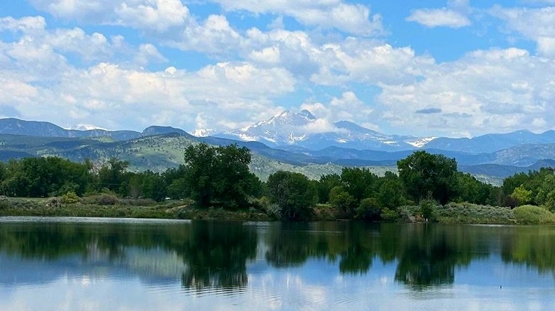 lake in Pella Crossing, Colorado with snowy mountains in the background
