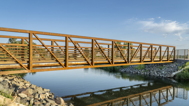 Bike path crossing river along the Poudre River Trail near Timnath, Colorado