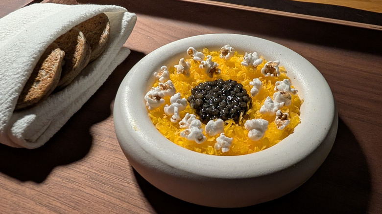 Dish with popcorn and caviar at The Wolf's Tailor in Denver, Colorado