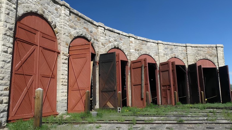 The stone exterior of the roundhouse at Como, Colorado, with rounded doors