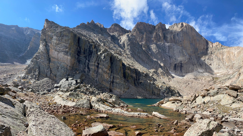Tall mountains surround Chasm Lake at Rocky Mountain National Park.