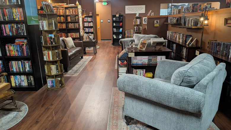 A cozy bookstore cafe with ample seating and rows of books