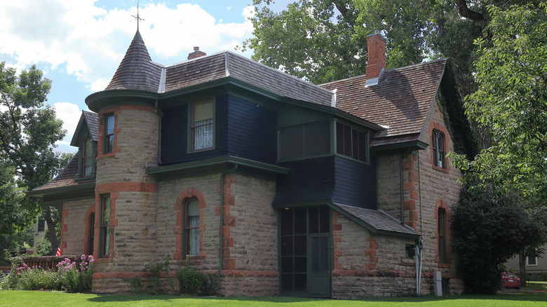 Exterior of the 1879 Avery House, a large sandstone home, in Fort Collins, Colorado