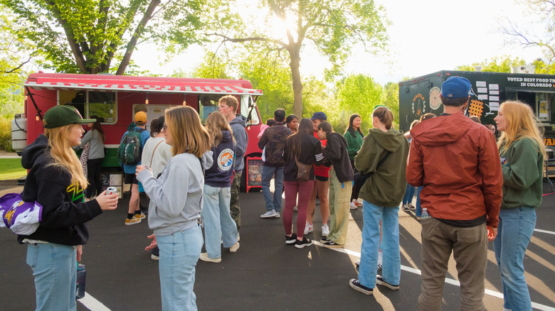 People enjoying food trucks at City Park in Fort Collins