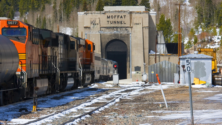 A train entering Moffat Tunnel in Colorado on a snowy day