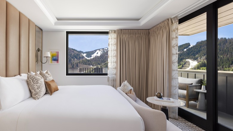 A bedroom in the Ajax Suite with mountain views at White Elephant Resort in Aspen