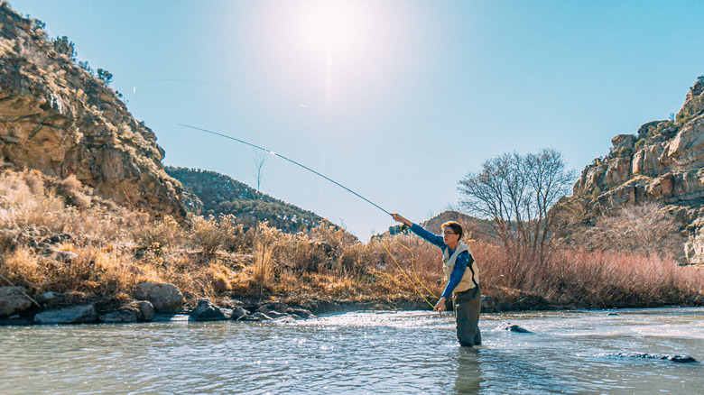 Person fishing in the water at Colorado Park