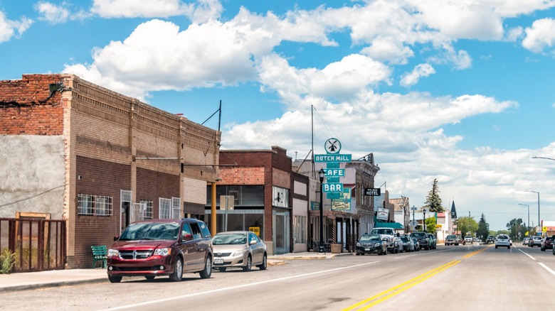 Cars, old buildings, and clear skies in Antonito, CO