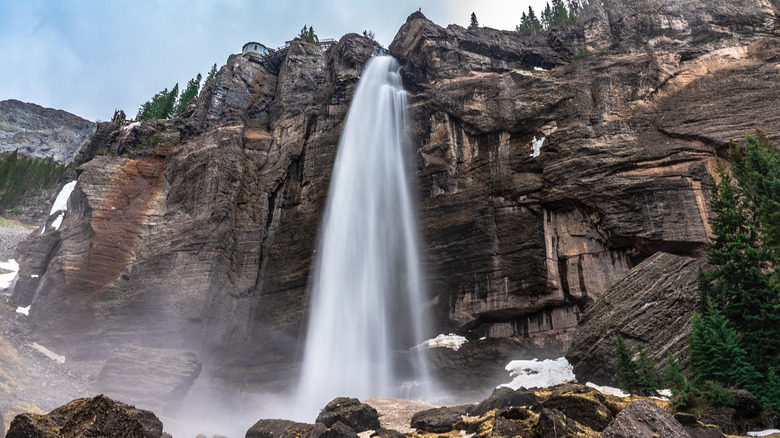 Bridal Veil Falls in Colorado flowing down rocky cliff.