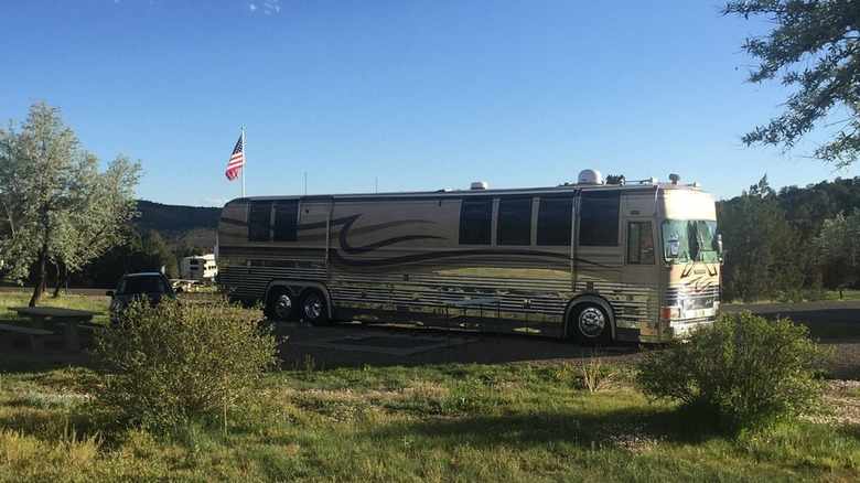 RV parked at Trinidad Lake State Park's campground on a sunny day in Colorado