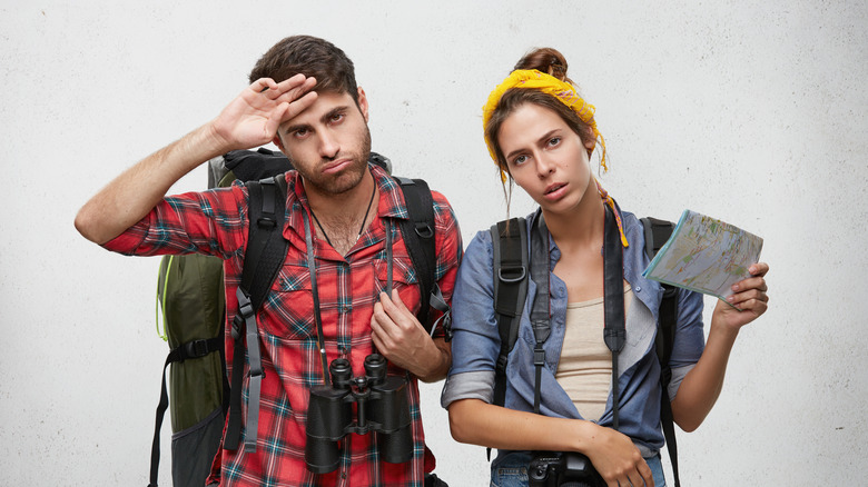 Travelers in uncomfortable clothing