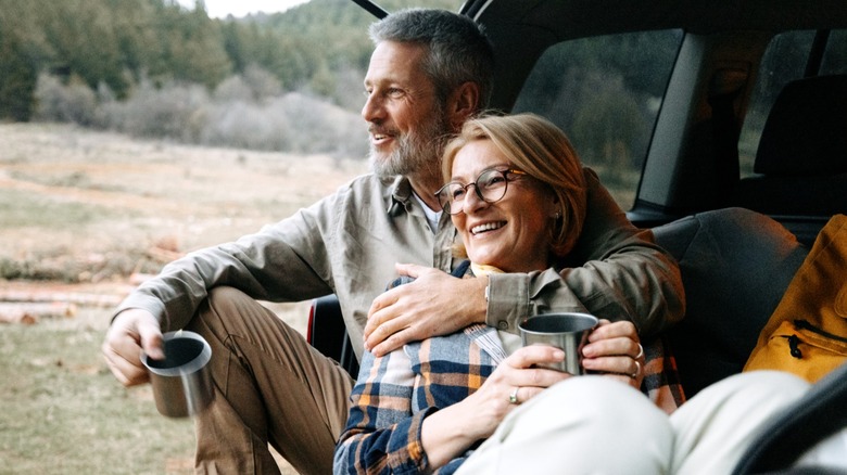 A couple embracing on a camping trip