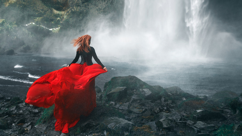 Fashion model at waterfall in Iceland