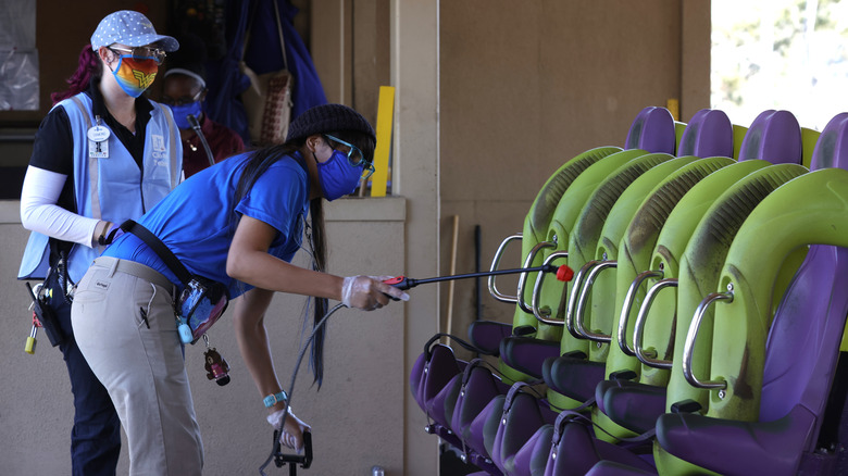 Workers cleaning the Medusa ride at Six Flags.