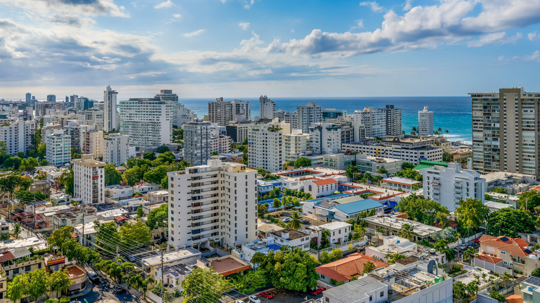 urban neighborhood in Puerto Rico with oceanfront high-rise buildings and greenery