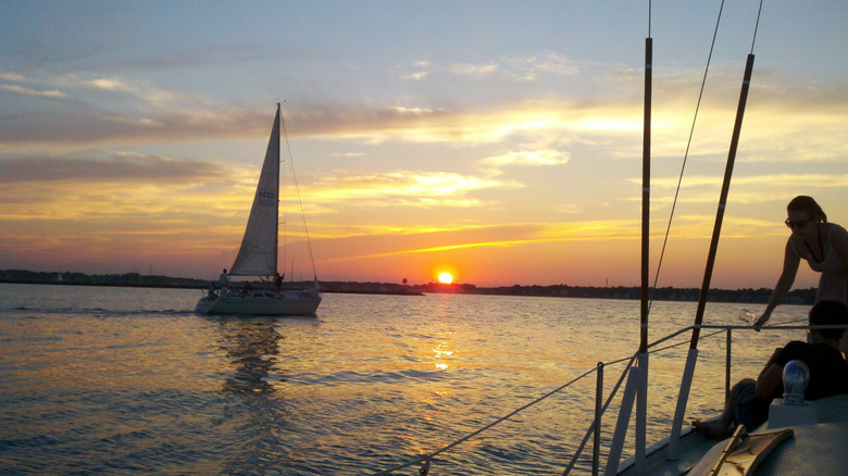 Boats on the water during sunset
