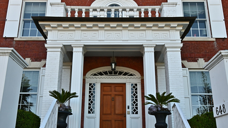 The stately entrance porch on one of Southport Connecticut's grand red brick colonial homes