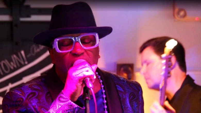 A blues musician singing in The Flat Five music venue in 1754 House Inn & Restaurant