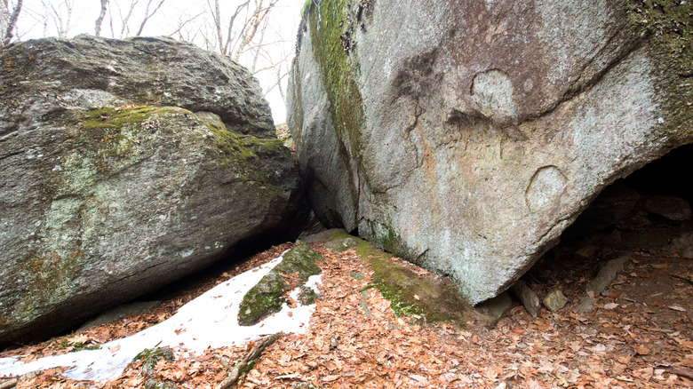 Large glacial boulders along the Tunxis Trail at Indian Council Caves in Barkhamsted, Connecticut.
