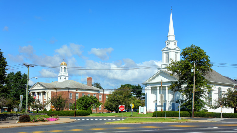 Street view of city buildings and church in Winchester, Connecticut