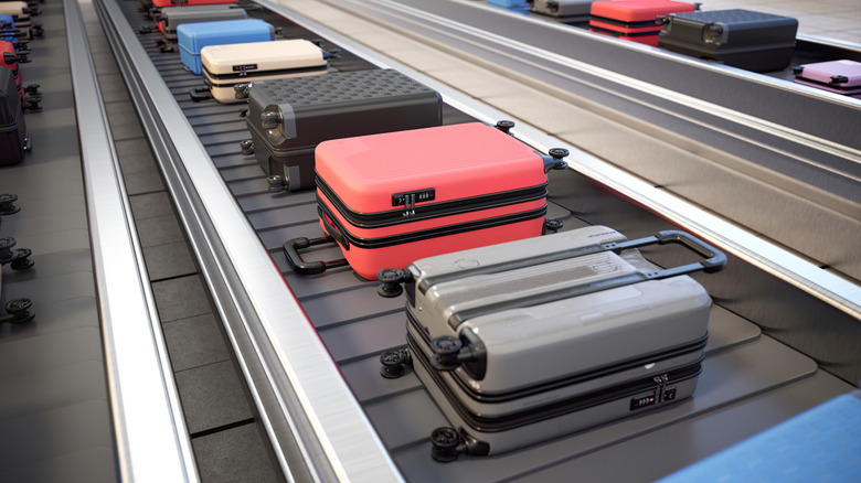 Suitcases on airport's baggage carousel